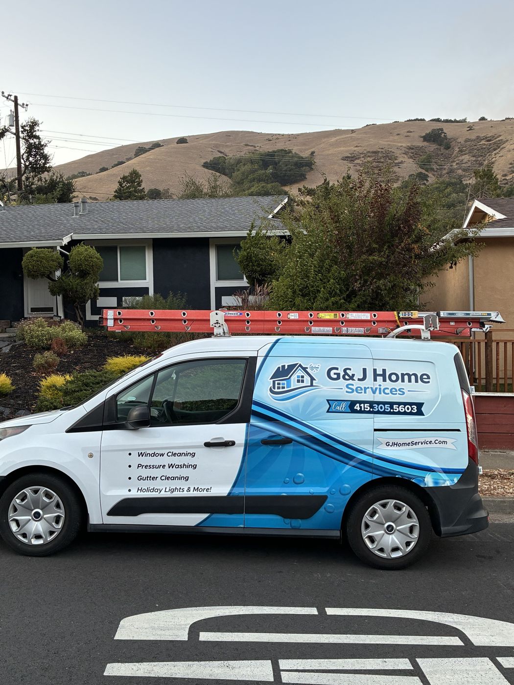 The wrapped G&J Home Services van parked at a Marin job